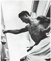A young Nishiyama Sensei punching the makiyara with gyaku-zuki (From his book 'Karate: The Art of Empty Hand Fighting'.)